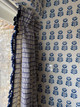 Crochet fabric in Indigo used as a curtain in an indigo-toned room, designed by Charlotte Elizabeth Design – a refined interplay of pattern and palette.